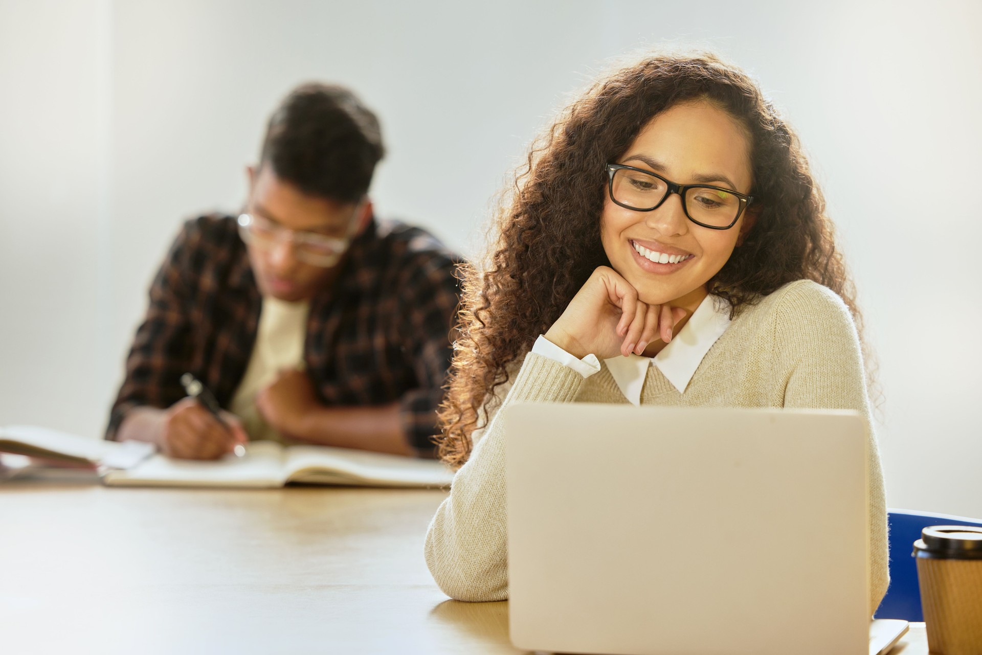 Cropped shot of an attractive young female college student working on her laptop while sitting in class