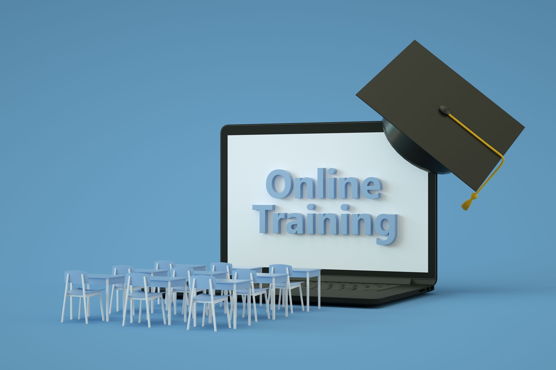 Online Training with Laptop, School Desks and Graduation Cap