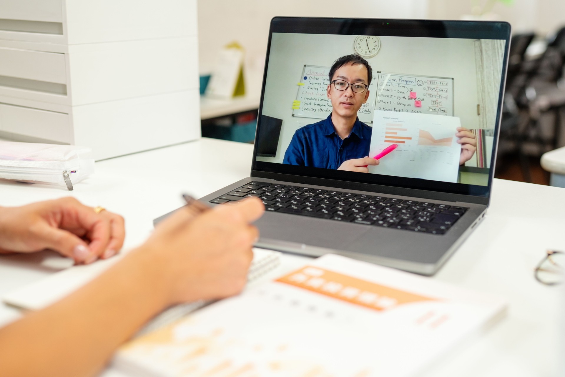 Point of view shot of a mid adult man giving online lessons